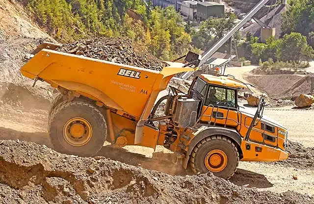 A Bell B60E operating at a high-altitude quarry in Austria.